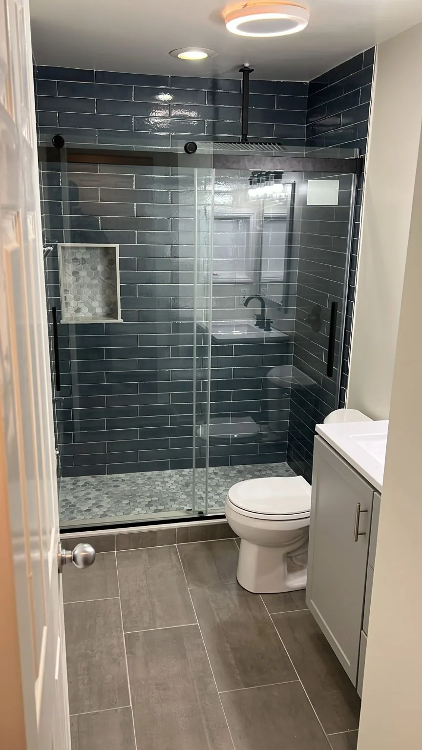 Blue tiled glass shower