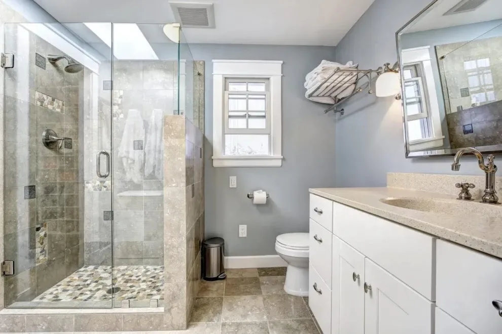 Gray bathroom with glass shower