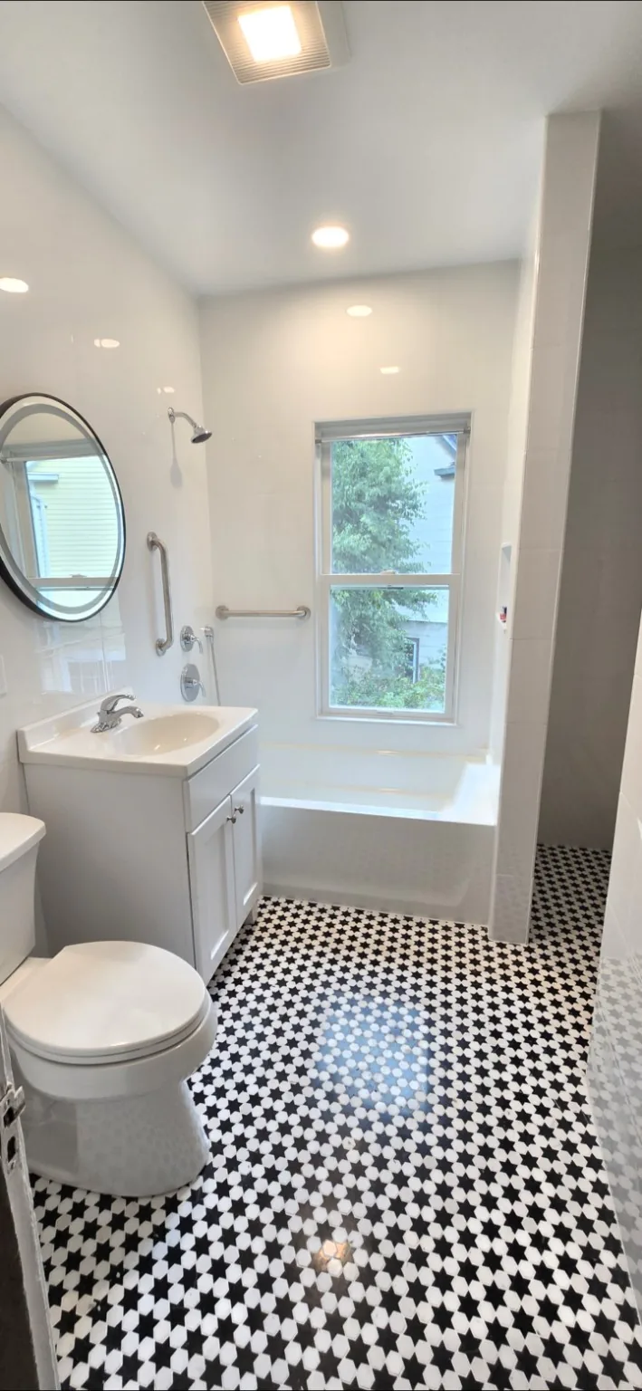 Bathroom with black and white patterned floor